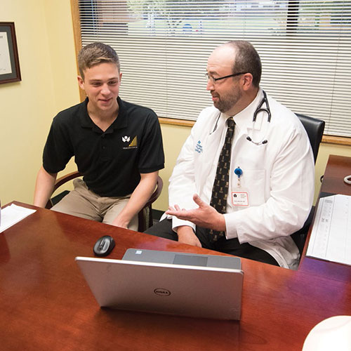Scott Perkins ’20 collaborated with Dr. Paul Nielsen ’95 (pictured) and Dr. Amy Jolliff, co-medical directors of the ϲʿֱֳ Community Care Network, and Alex Davis, director, to evaluate the outcomes of the Health Coach program.