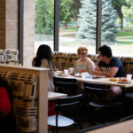 Students eat and socialize in the newly renovated dining area of the Lowry Center at ϲʿֱֳ.